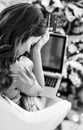 Stressed woman with credit card and laptop in front of chr