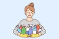 Stressed woman with detergent bottles