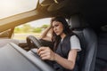 Stressed woman sitting inside a car Royalty Free Stock Photo