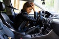 Stressed woman driver sitting inside her car on the road Royalty Free Stock Photo