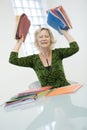 Stressed woman with folders