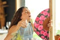 Stressed woman getting hot fanning in a restaurant Royalty Free Stock Photo