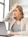 Stressed woman with laptop computer Royalty Free Stock Photo