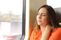 Stressed woman with neck ache in a train wagon Royalty Free Stock Photo