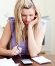 Stressed woman paying her bills Royalty Free Stock Photo