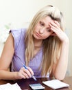 Stressed woman paying her bills Royalty Free Stock Photo