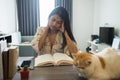 Stressed woman read book and feel headache in house Royalty Free Stock Photo