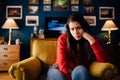 Stressed woman thinking of problems/solution.Annoyed and bored at home.Impatience and anger for partner.Irritating behavior Royalty Free Stock Photo