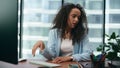 Stressed woman tired work sitting at office desk closeup. Girl worker depressed Royalty Free Stock Photo