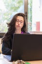 Stressed woman at work into office in front of the notebook. Burn out syndrome concept Royalty Free Stock Photo