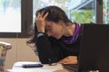 Stressed woman at work into office in front of the notebook. Burn out syndrome concept Royalty Free Stock Photo