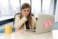 Stressed woman working with laptop computer on desk in overworked Royalty Free Stock Photo