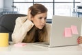 Stressed woman working with laptop computer on desk in overworked Royalty Free Stock Photo