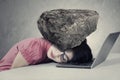 Stressed worker with a burden on her head Royalty Free Stock Photo