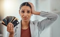 Stressed, worried businesswoman in debt from shopping at work. Female in corporate finance, money issues headache, holds