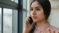 Stressed worried Indian Arabian businesswoman speak mobile phone talking negotiate cellphone annoyed angry woman girl Royalty Free Stock Photo