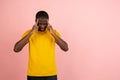 Stressed young african american man feel pain and having terrible strong headache concept. Tired upset black guy Royalty Free Stock Photo