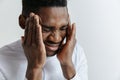 Stressed young african american man having terrible strong headache. Royalty Free Stock Photo