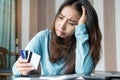 Stressed young woman trying to find money to pay credit card debt Royalty Free Stock Photo