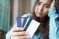 Stressed young woman trying to find money to pay credit card debt Royalty Free Stock Photo