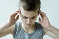 Stressed Young Boy Holding Temples with Hands Royalty Free Stock Photo