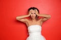 Stressed young bride on color background