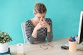 Stressed young business woman suffering anxiety while working in the office Royalty Free Stock Photo