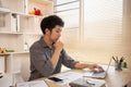 Stressed Young Businessman Facing Financial Loss in Corporate Office Royalty Free Stock Photo