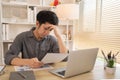 Stressed Young Businessman Facing Financial Loss in Corporate Office Royalty Free Stock Photo