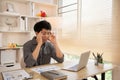 Stressed Young Businessman Facing Financial Loss in Corporate Office Royalty Free Stock Photo