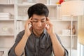 Stressed Young Businessman Facing Financial Loss in Corporate Office Royalty Free Stock Photo