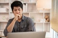 Stressed Young Businessman Facing Financial Loss in Corporate Office Royalty Free Stock Photo