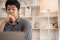 Stressed Young Businessman Facing Financial Loss in Corporate Office Royalty Free Stock Photo