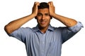 Stressed young businessman holding his head Royalty Free Stock Photo