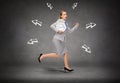 Stressed young businesswoman with clock running Royalty Free Stock Photo