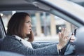 Stressed young businesswoman driving her car Royalty Free Stock Photo