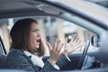 Stressed young businesswoman driving her car Royalty Free Stock Photo