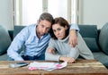 Young Couple Feeling sad and stressed paying bills debts mortgage having financial problems Royalty Free Stock Photo