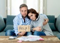 Young Couple Feeling sad and stressed paying bills debts mortgage having financial problems Royalty Free Stock Photo