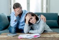 Young Couple Feeling sad and stressed paying bills debts mortgage having financial problems Royalty Free Stock Photo