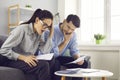 Stressed young couple checking analyzing family bills calculating taxes at home Royalty Free Stock Photo