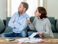 Stressed young couple having an argument over credit car debts payments and home finance Royalty Free Stock Photo