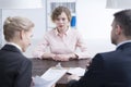 Stressed young girl and recruiters Royalty Free Stock Photo