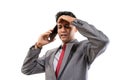 stressed young man wearing suit hold his head while making a phone Royalty Free Stock Photo
