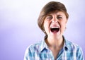 Stressed young woman shouting with purple background Royalty Free Stock Photo