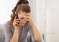 Stressed young woman talking cell phone Royalty Free Stock Photo