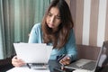 Stressed young woman trying to find money to pay credit card debt Royalty Free Stock Photo