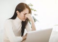 Stressed young woman working with computer at home Royalty Free Stock Photo