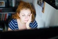 Stressed young woman working late on a computer Royalty Free Stock Photo