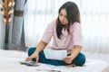 Stressed young woman worrying many credit card invoice in her hands. person with a financial debt problem